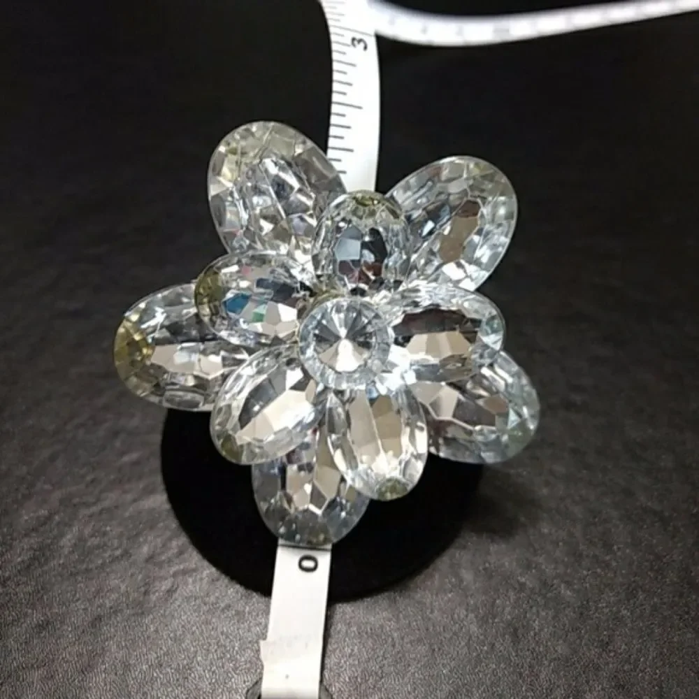 Silver tone sparkly flower bling ring